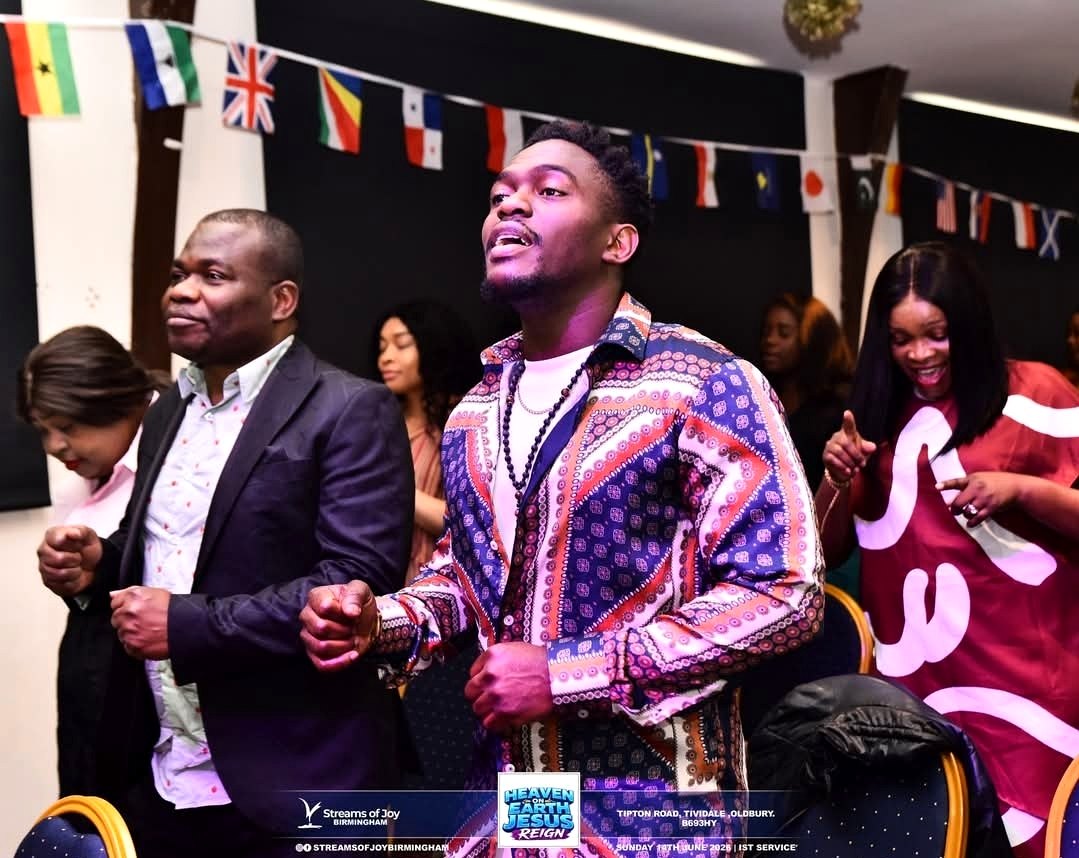 Streams of Joy Birmingham worship moment with men and congregation